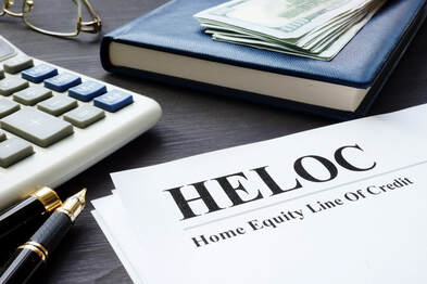 Image of a Home Equity Line of Credit Contract on a Mortgage Brokers desk